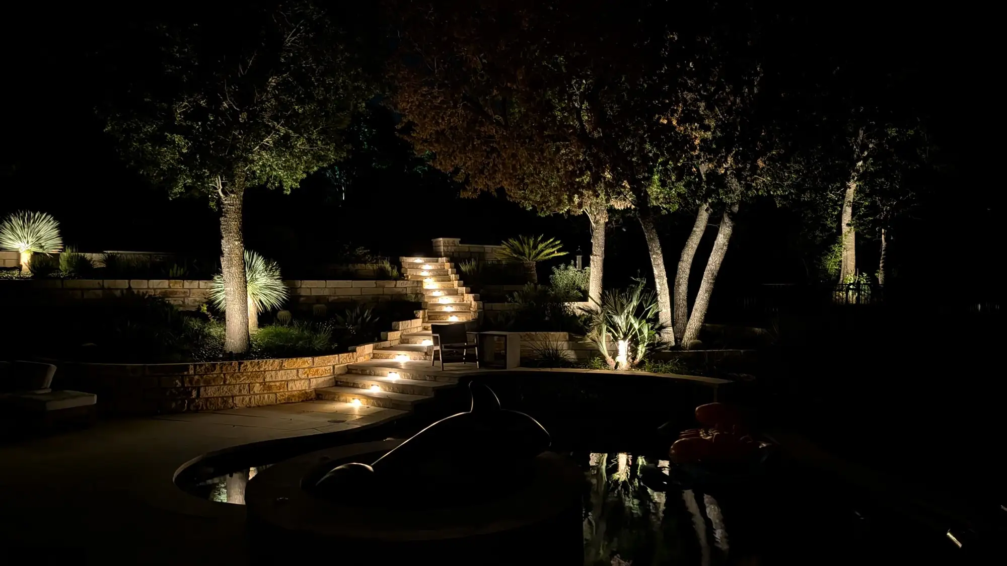 Clarion Cove terraces and stairway lit at night