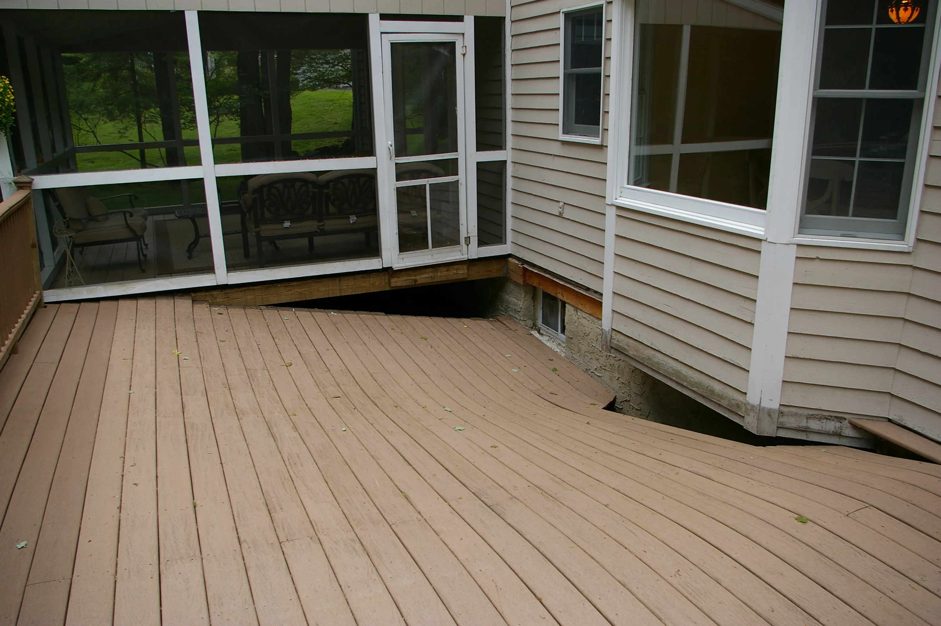 Deck structural failure — collapsed framing and boards