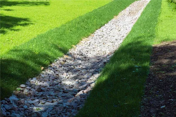 Simple river rock natural drain