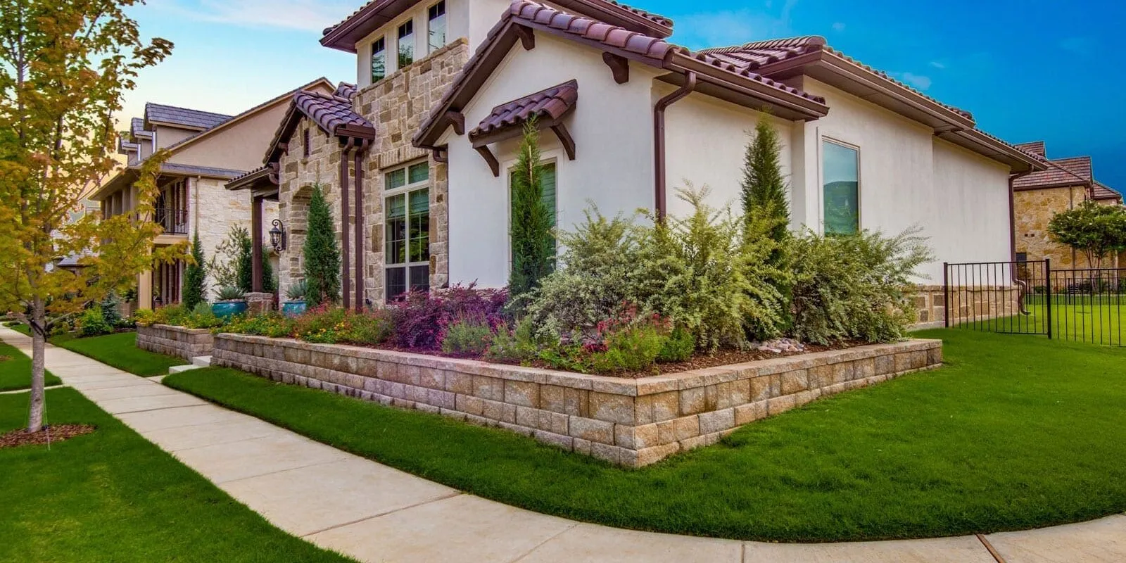 Lush, mature landscaping framing a luxury Central Texas residence