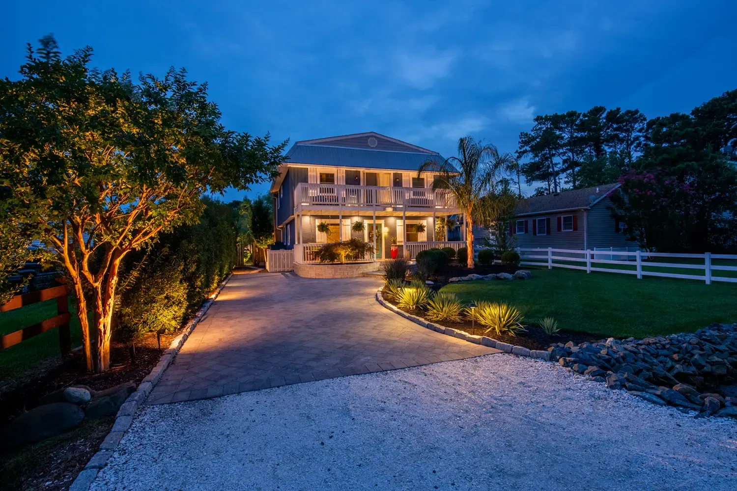 Landscape lighting illuminating pathways and planting at night