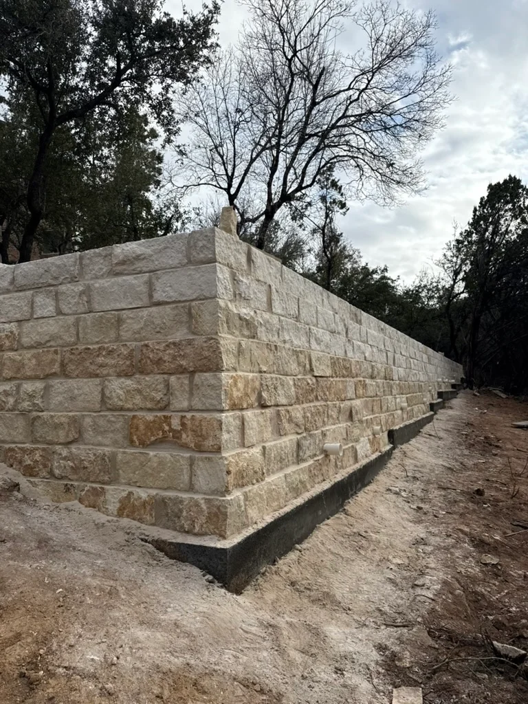Chopped limestone retaining wall on an Austin hillside