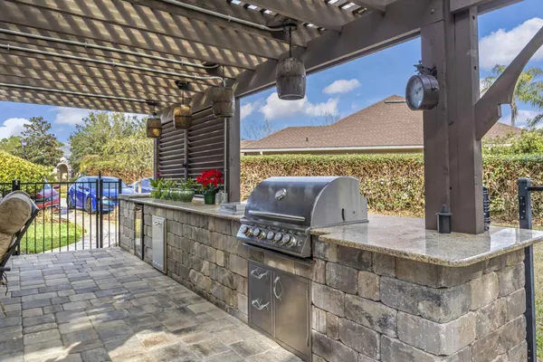 Paver patio with outdoor kitchen