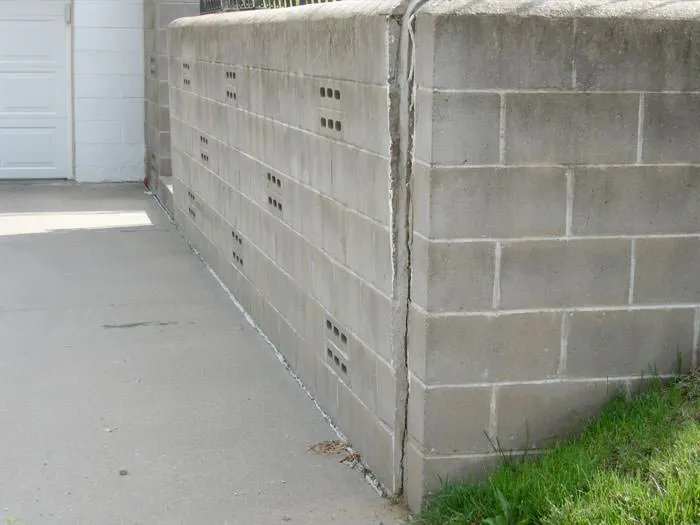 Retaining wall repair and restoration on an Austin residential property