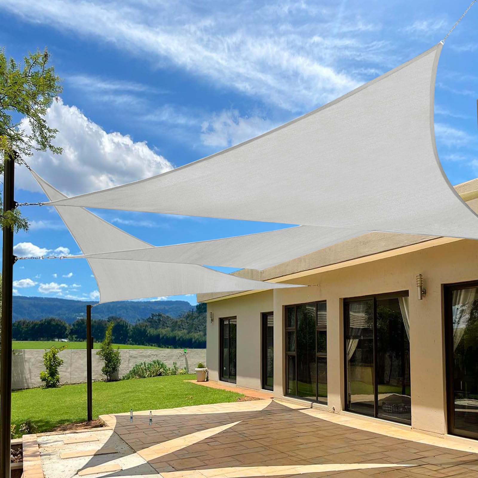 A shade sail over a concrete patio